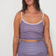 Woman wearing a merlot striped swimsuit, tankini surf top and betty bottoms 2.0 against a white background, free people and salt gypsy